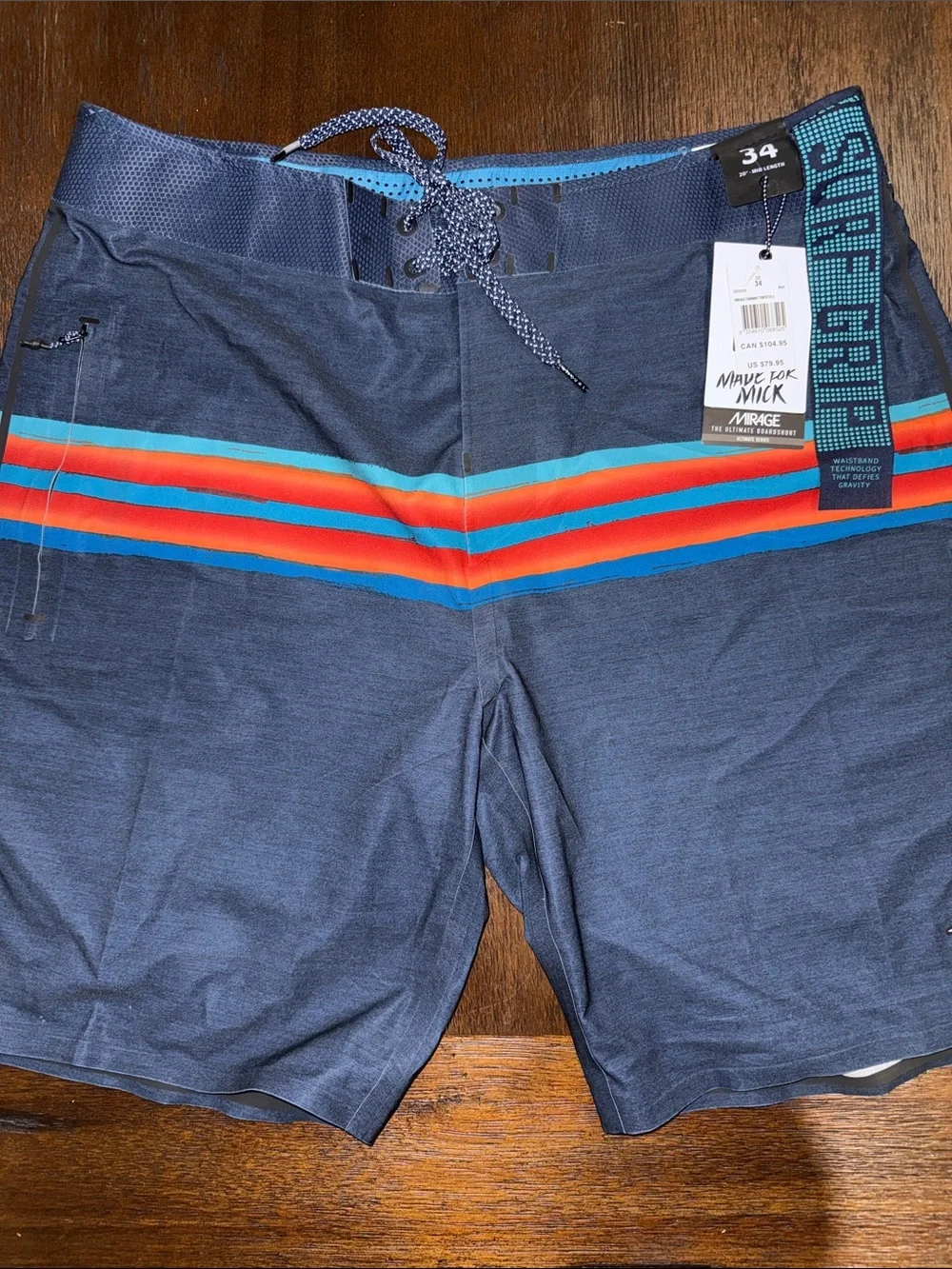 Rip Curl Mirage Mick Fanning Navy Board Shorts with Red & Aqua Stripes 34